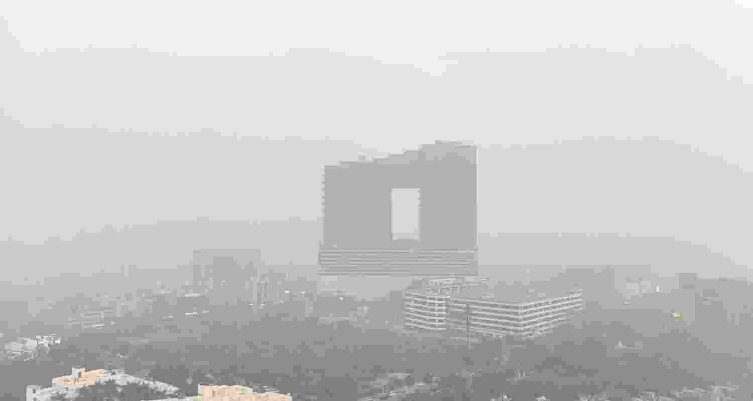 A layer of smog engulfs the city on a winter day, in Noida, Thursday. A layer of smog engulfs the city on a winter day, in Noida, Thursday.