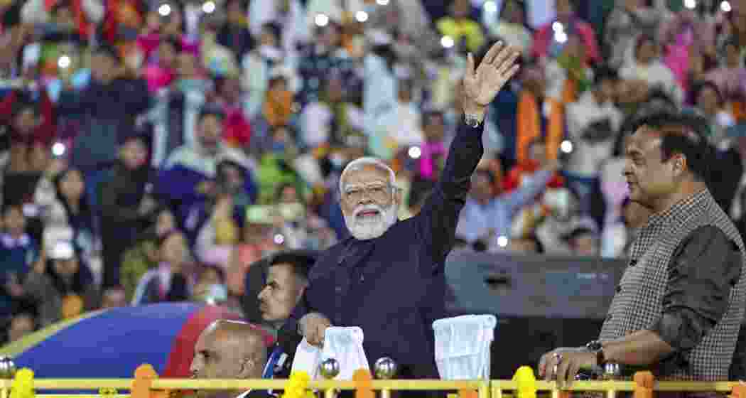 Prime Minister Narendra Modi with Assam Chief Minister Himanta Biswa Sarma waves to the gathering during Traditional Bodo Cultural Programme, in Guwahati. Prime Minister Narendra Modi with Assam Chief Minister Himanta Biswa Sarma waves to the gathering during Traditional Bodo Cultural Programme, in Guwahati.