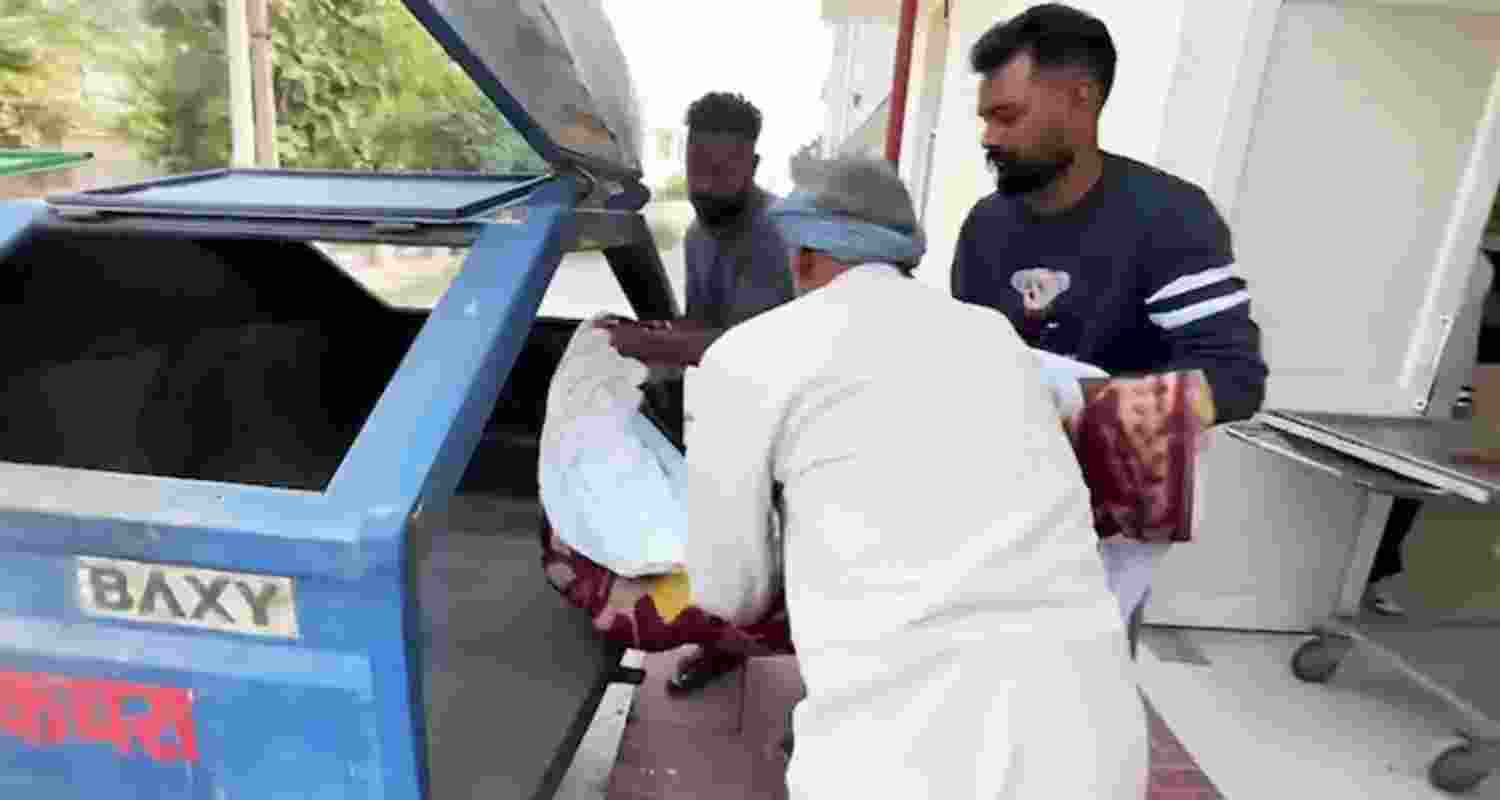 An unclaimed body being but in a garbage trolley at a civil hospital in Punjab's Phagwara. An unclaimed body being but in a garbage trolley at a civil hospital in Punjab's Phagwara.