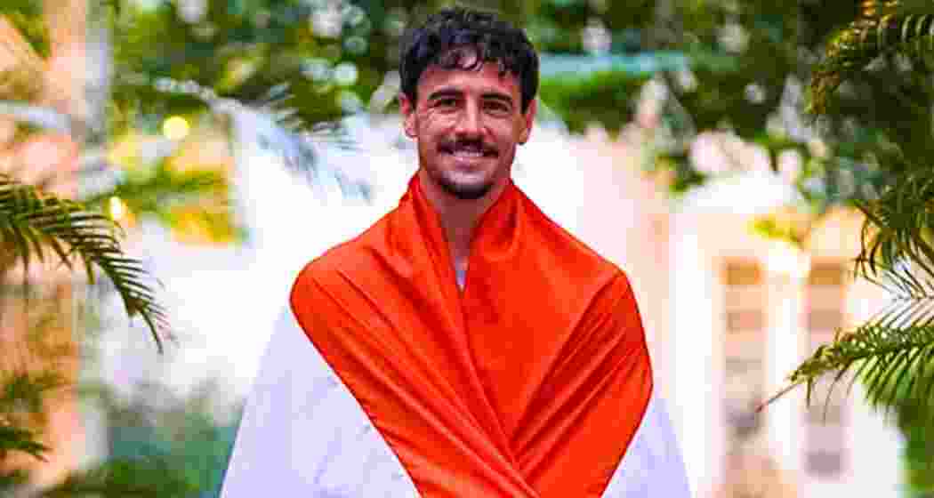 Footballer Ryan Williams poses with the Tricolour draped across him. Footballer Ryan Williams poses with the Tricolour draped across him.