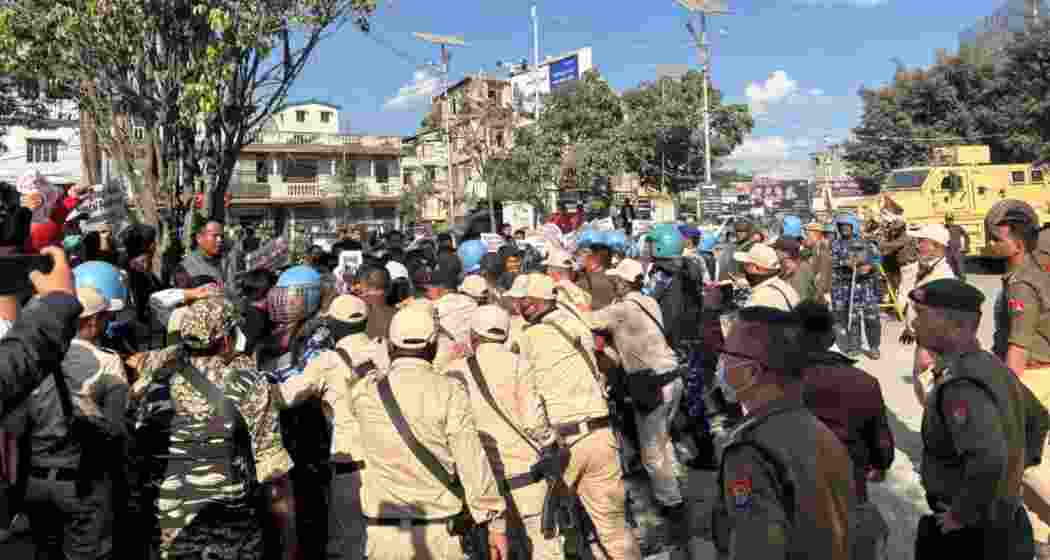 Protesters attempt to march toward the Sangai festival venue in Imphal. Protesters attempt to march toward the Sangai festival venue in Imphal.