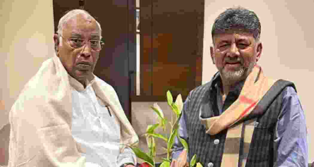 Karnataka Deputy Chief Minister D K Shivakumar with Congress President Mallikarjun Kharge in Bengaluru on Thursday. Karnataka Deputy Chief Minister D K Shivakumar with Congress President Mallikarjun Kharge in Bengaluru on Thursday.