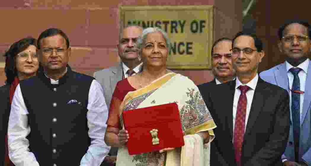 Union Minister for Finance and Corporate Affairs Nirmala Sitharaman along with the Ministers of State for Finance Pankaj Chaudhary and team members of Finance, outside the her office at North Block in New Delhi. Union Minister for Finance and Corporate Affairs Nirmala Sitharaman along with the Ministers of State for Finance Pankaj Chaudhary and team members of Finance, outside the her office at North Block in New Delhi.