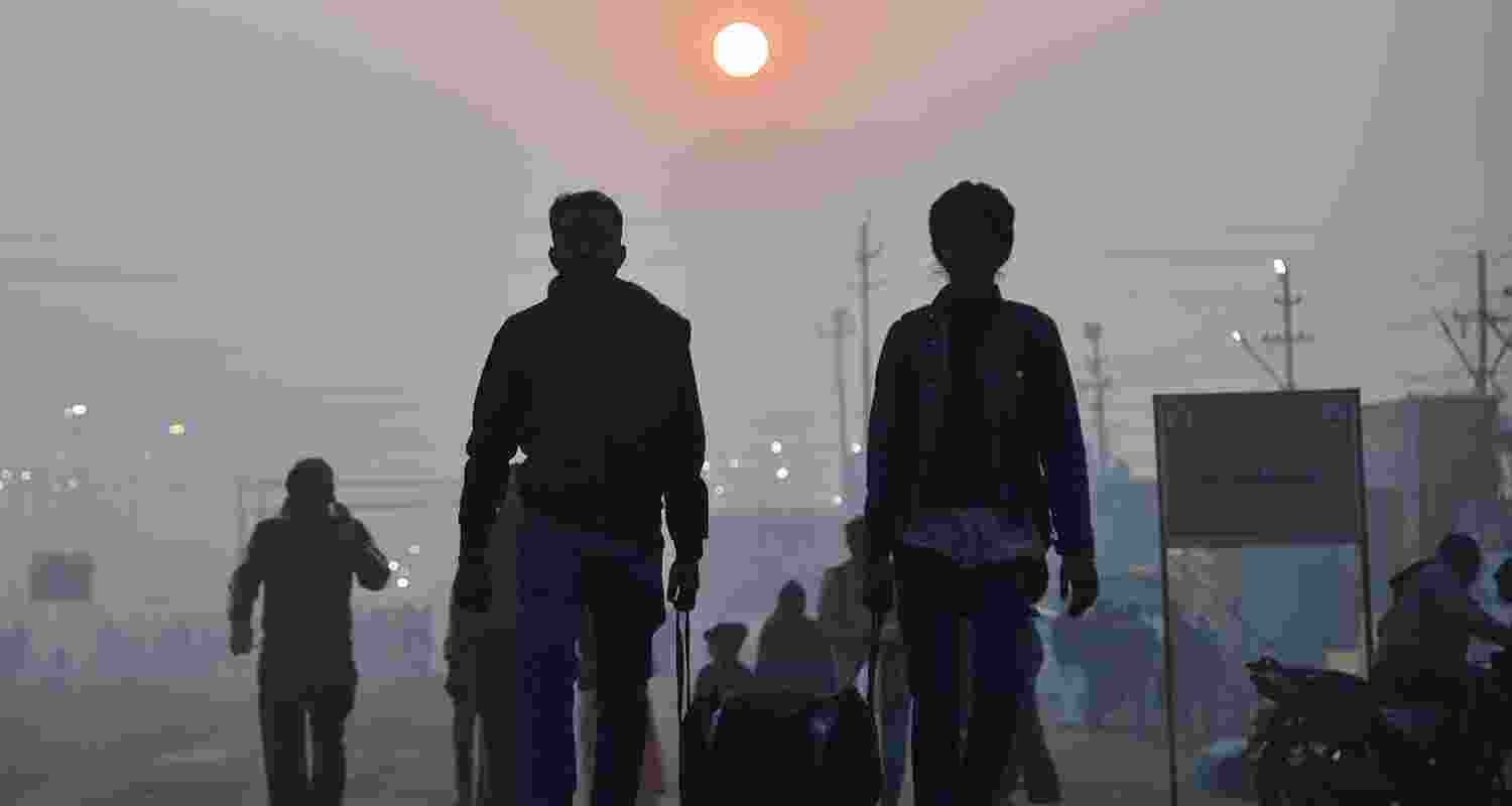 Devotees arrive to offer prayers on a foggy winter morning during the Magh Mela festival, at Sangam, in Prayagraj, Sunday. Devotees arrive to offer prayers on a foggy winter morning during the Magh Mela festival, at Sangam, in Prayagraj, Sunday.