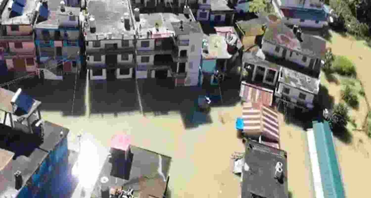 Water reaching the residential area due to the lake formation . Water reaching the residential area due to the lake formation .