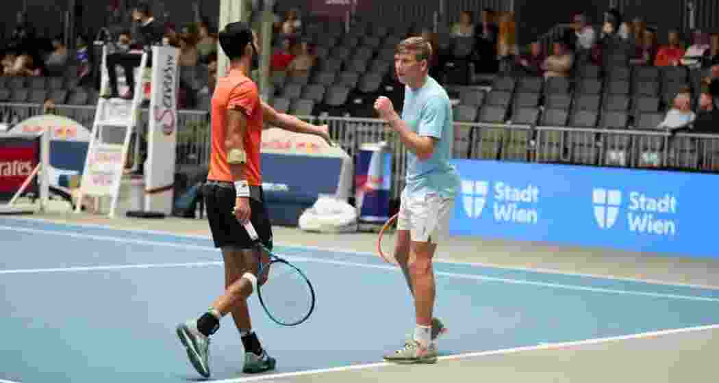 Yuki Bhambri and Andre Göransson celebrate a point during their doubles match. Yuki Bhambri and Andre Göransson celebrate a point during their doubles match.