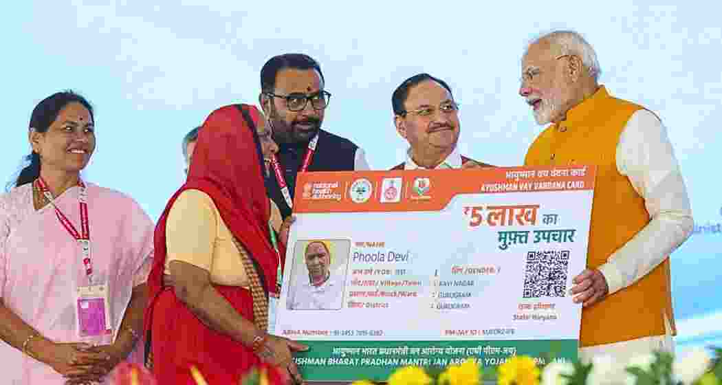 Prime Minister Narendra Modi hands over Ayushman Vaya Vandana Card to a beneficiary in New Delhi. (Image: PTI) Prime Minister Narendra Modi hands over Ayushman Vaya Vandana Card to a beneficiary in New Delhi. (Image: PTI)