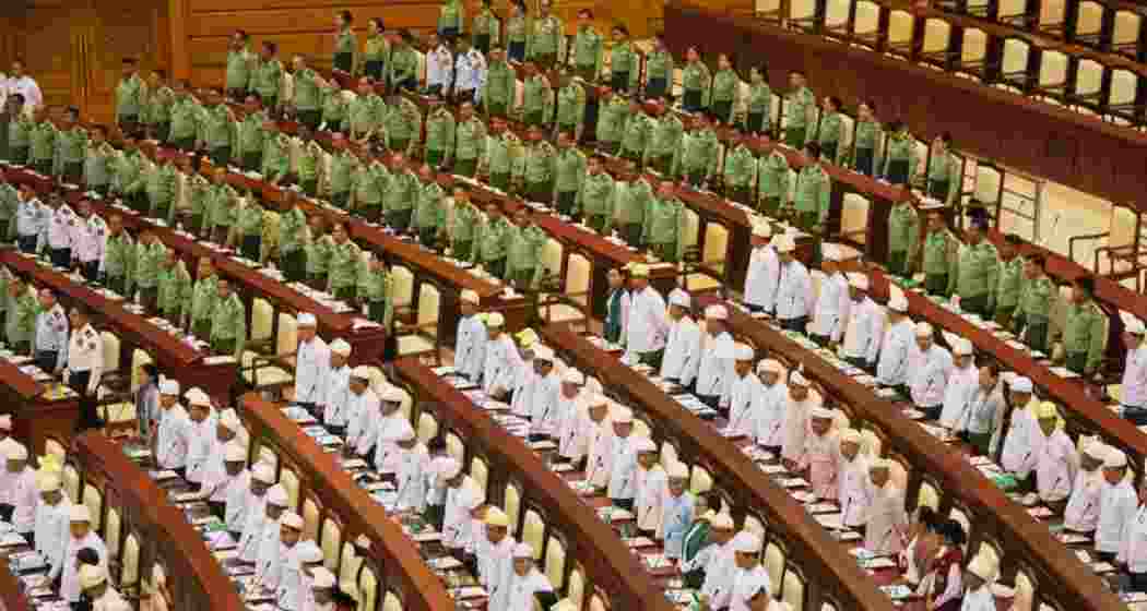 Myanmar’s military representatives and lawmakers being sworn in during a parliament session in Naypyitaw on Monday. Myanmar’s military representatives and lawmakers being sworn in during a parliament session in Naypyitaw on Monday.