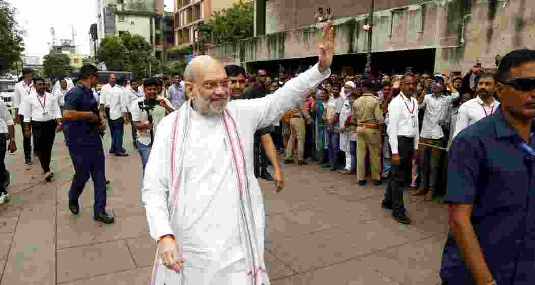 Union Home Minister Amit Shah waves during his visit to the Nagardevi Bhadrakali Mata Temple, in Ahmedabad, Sunday. Union Home Minister Amit Shah waves during his visit to the Nagardevi Bhadrakali Mata Temple, in Ahmedabad, Sunday.