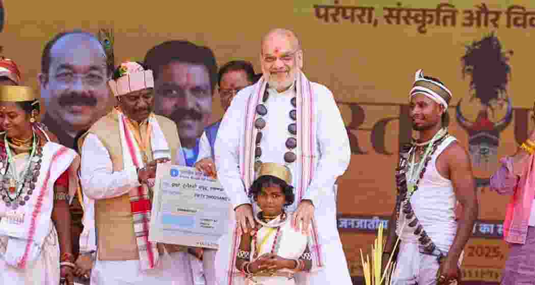 Union Home Minister Amit Shah interacts with locals and shares a moment with children in Jagdalpur during his visit to the Bastar region of Chhattisgarh. Union Home Minister Amit Shah interacts with locals and shares a moment with children in Jagdalpur during his visit to the Bastar region of Chhattisgarh.