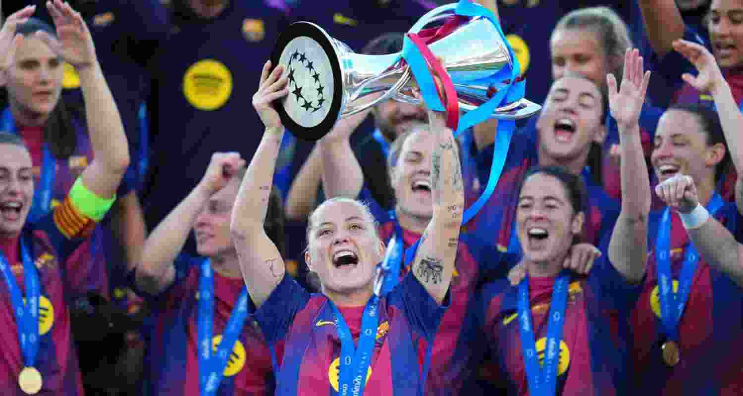 Barcelona's Claudia Pina celebrates with the trophy after winning the Women's Champions League final soccer match between FC Barcelona and OL Lyonnes, in Oslo, Saturday, May 23, 2026. Barcelona's Claudia Pina celebrates with the trophy after winning the Women's Champions League final soccer match between FC Barcelona and OL Lyonnes, in Oslo, Saturday, May 23, 2026.