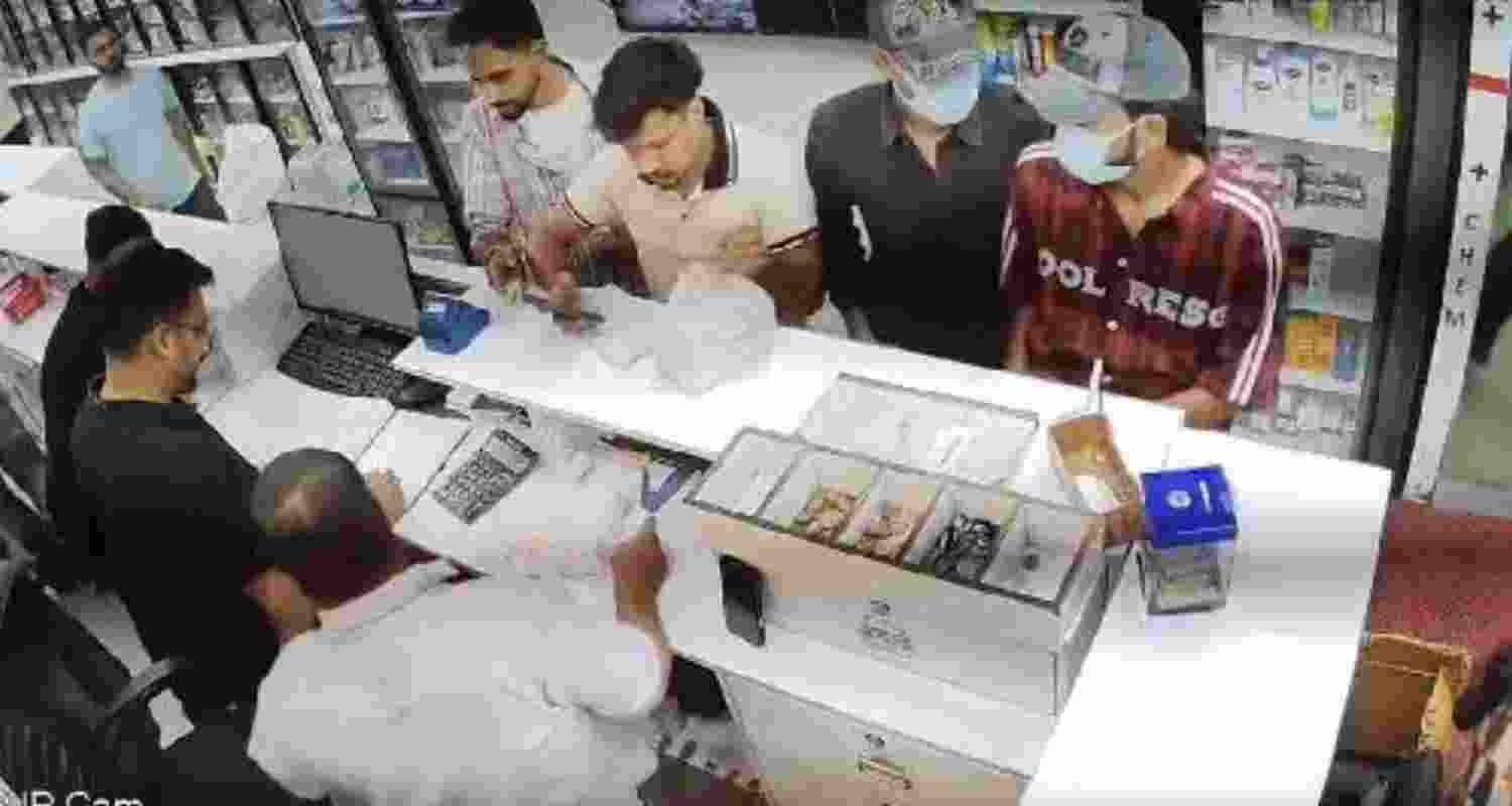 CCTV grab shows masked assailants inside Kumar Medical Store moments before the firing incident in Chandigarh's Sector 11 on Saturday. CCTV grab shows masked assailants inside Kumar Medical Store moments before the firing incident in Chandigarh's Sector 11 on Saturday.