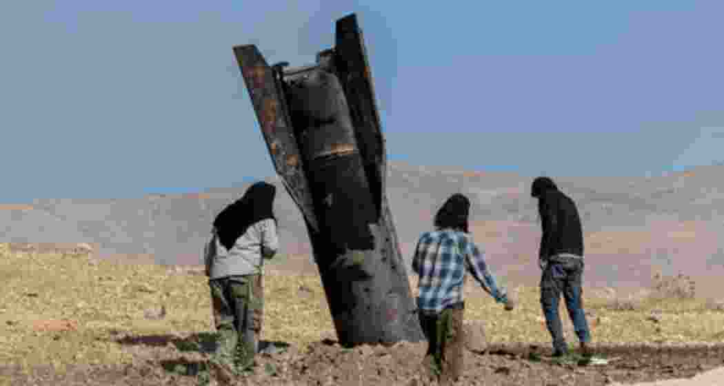 People stand next to part of a missile protruding from the ground, following strikes from Iran, in the central West Bank, 8 June, 2026. Photograph: Naama Stern/Reuters. People stand next to part of a missile protruding from the ground, following strikes from Iran, in the central West Bank, 8 June, 2026. Photograph: Naama Stern/Reuters.