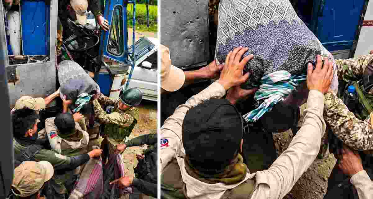 Security personnel bring down the body of the truck driver who was shot dead during a militant ambush on a security-escorted convoy in Manipur’s Ukhrul district on Friday. Security personnel bring down the body of the truck driver who was shot dead during a militant ambush on a security-escorted convoy in Manipur’s Ukhrul district on Friday.
