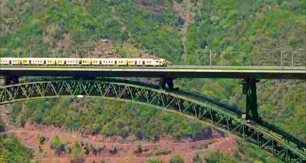 A train crosses the iconic Chenab Bridge during a trial run ahead of its formal inauguration by Prime Minister Narendra Modi. A train crosses the iconic Chenab Bridge during a trial run ahead of its formal inauguration by Prime Minister Narendra Modi.