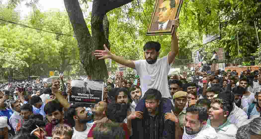 A supporter carries the Cockroach Janta Party (CJP) founder Abhijeet Dipke over his shoulder. A supporter carries the Cockroach Janta Party (CJP) founder Abhijeet Dipke over his shoulder.