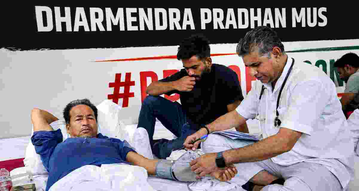 Climate activist and educationist Sonam Wangchuk being attended by a medical professional as Cockroach Janata Party (CJP) founder Abhijeet Dipke looks on during a hunger strike by CJP demanding action over alleged irregularities in examinations and seeking the resignation of Union Education Minister Dharmendra Pradhan, at Jantar Mantar, in New Delhi on Saturday. Wangchuk is on the seventh day of his indefinite hunger strike in support of the youth-led protest. Climate activist and educationist Sonam Wangchuk being attended by a medical professional as Cockroach Janata Party (CJP) founder Abhijeet Dipke looks on during a hunger strike by CJP demanding action over alleged irregularities in examinations and seeking the resignation of Union Education Minister Dharmendra Pradhan, at Jantar Mantar, in New Delhi on Saturday. Wangchuk is on the seventh day of his indefinite hunger strike in support of the youth-led protest.