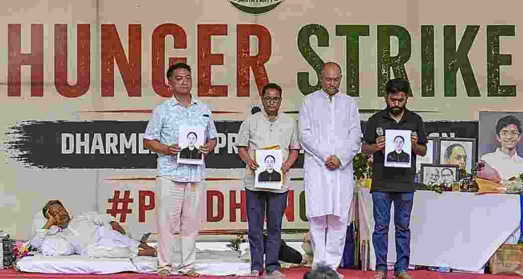 CJP founder Abhijeet Dipke with parent of a 23-year-old NEET aspirant who allegedly died by suicide in Dehradun, during the protest at Jantar Mantar, on Sunday. (Photo:PTI) CJP founder Abhijeet Dipke with parent of a 23-year-old NEET aspirant who allegedly died by suicide in Dehradun, during the protest at Jantar Mantar, on Sunday. (Photo:PTI)