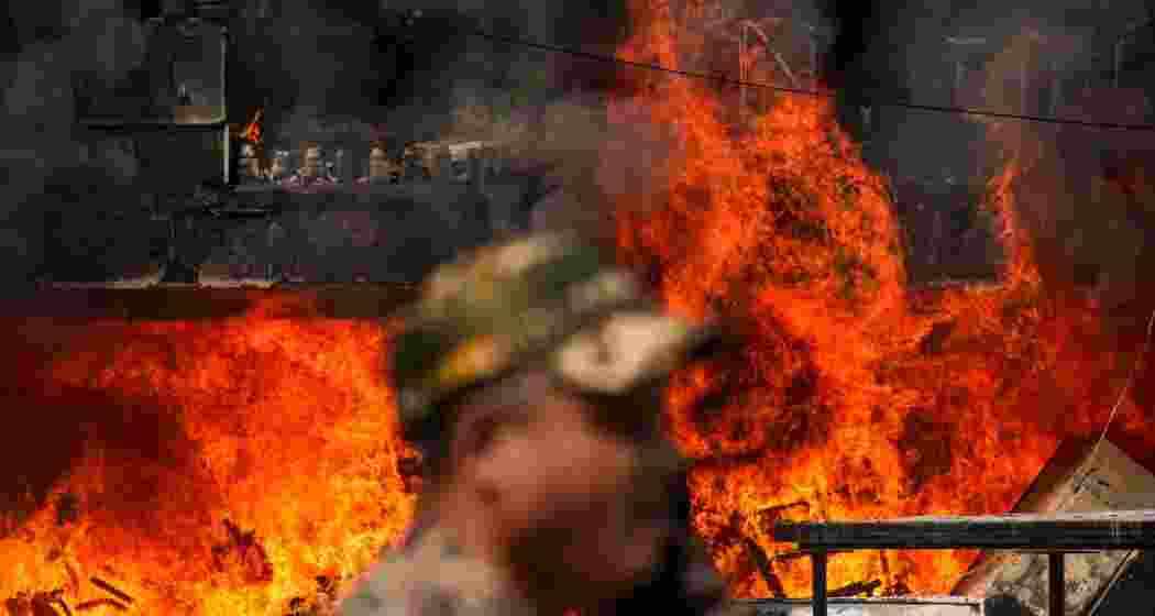 Flames rise after a fire broke out at Brahmaputra Apartments, in New Delhi, Saturday. Flames rise after a fire broke out at Brahmaputra Apartments, in New Delhi, Saturday.