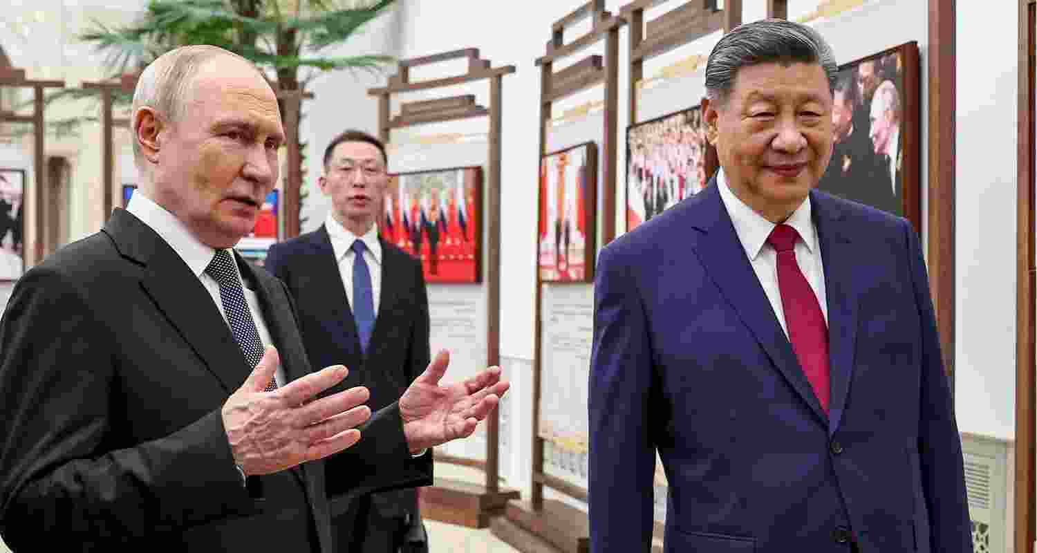Russian President Vladimir Putin and Chinese President Xi Jinping visit an exhibition by the TASS and Xinhua news agencies at the Great Hall of the People in Beijing, China, on Wednesday. Russian President Vladimir Putin and Chinese President Xi Jinping visit an exhibition by the TASS and Xinhua news agencies at the Great Hall of the People in Beijing, China, on Wednesday.
