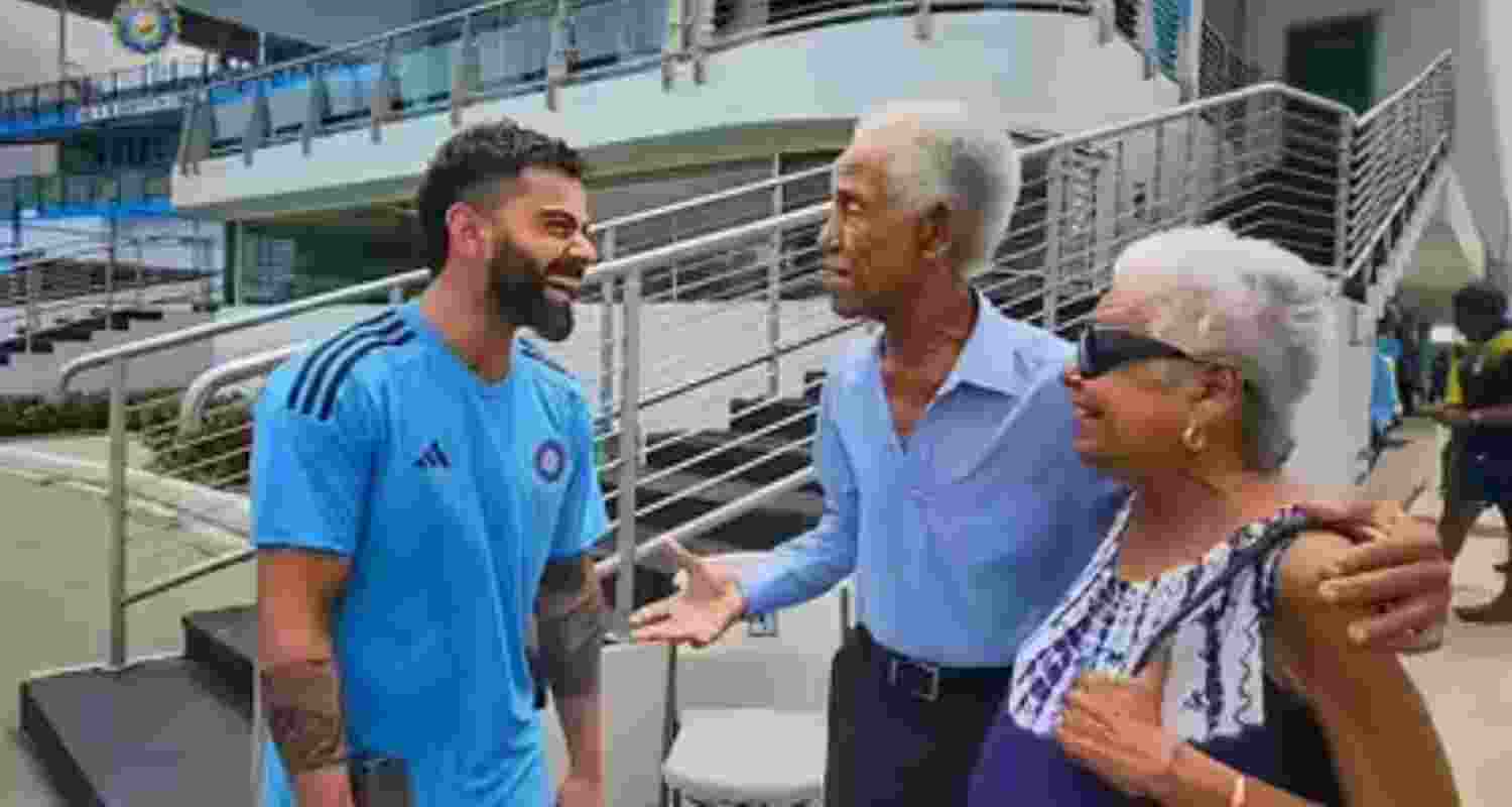 A file photograph of Virat Kohli with Sir Garry Sobers and his wife. A file photograph of Virat Kohli with Sir Garry Sobers and his wife.