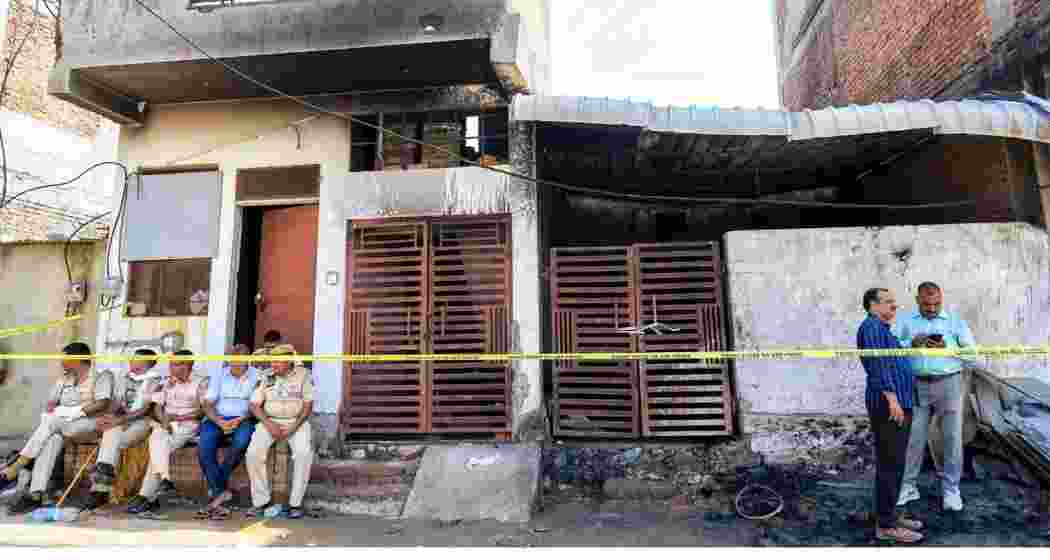 Police officials at the site after a fire broke out in a factory operated in a small house in Jaipur's Kho-Nagorian area on Tuesday. Police officials at the site after a fire broke out in a factory operated in a small house in Jaipur's Kho-Nagorian area on Tuesday.