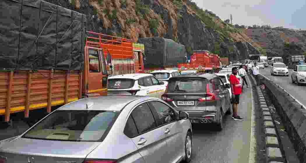 Commuters stand idle as traffic remains halted on the Mumbai-Pune Expressway near Khopoli during the 33-hour disruption following a gas tanker mishap earlier this month. Commuters stand idle as traffic remains halted on the Mumbai-Pune Expressway near Khopoli during the 33-hour disruption following a gas tanker mishap earlier this month.