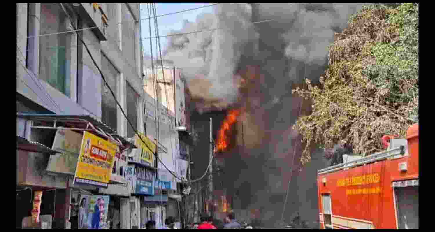 Firefighters battle a massive blaze at a shoe showroom in Rohtak's D Park area. Firefighters battle a massive blaze at a shoe showroom in Rohtak's D Park area.
