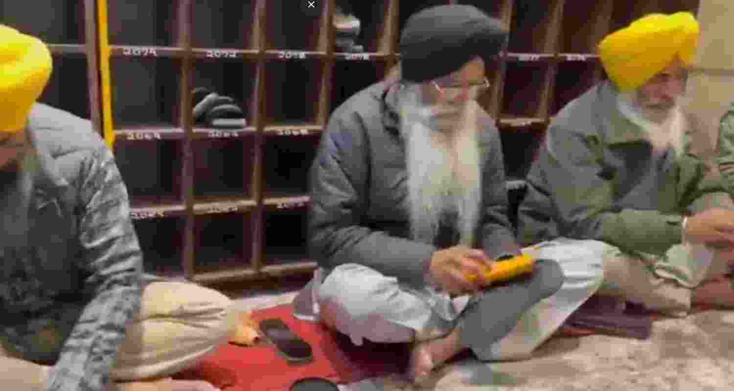 SGPC chief Harjinder Singh Dhami cleaning shoes at the Golden Temple. SGPC chief Harjinder Singh Dhami cleaning shoes at the Golden Temple.
