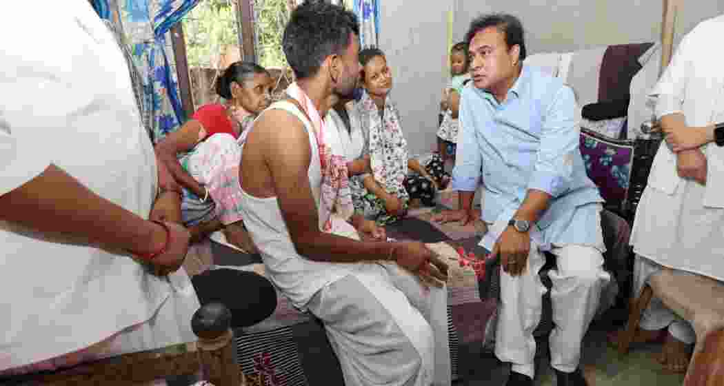 Assam CM Himanta Biswa Sarma consoling the parents of Avinash, who tragically lost his life after falling into a drain during heavy rains and floods in Guwahati on July 4. Assam CM Himanta Biswa Sarma consoling the parents of Avinash, who tragically lost his life after falling into a drain during heavy rains and floods in Guwahati on July 4.