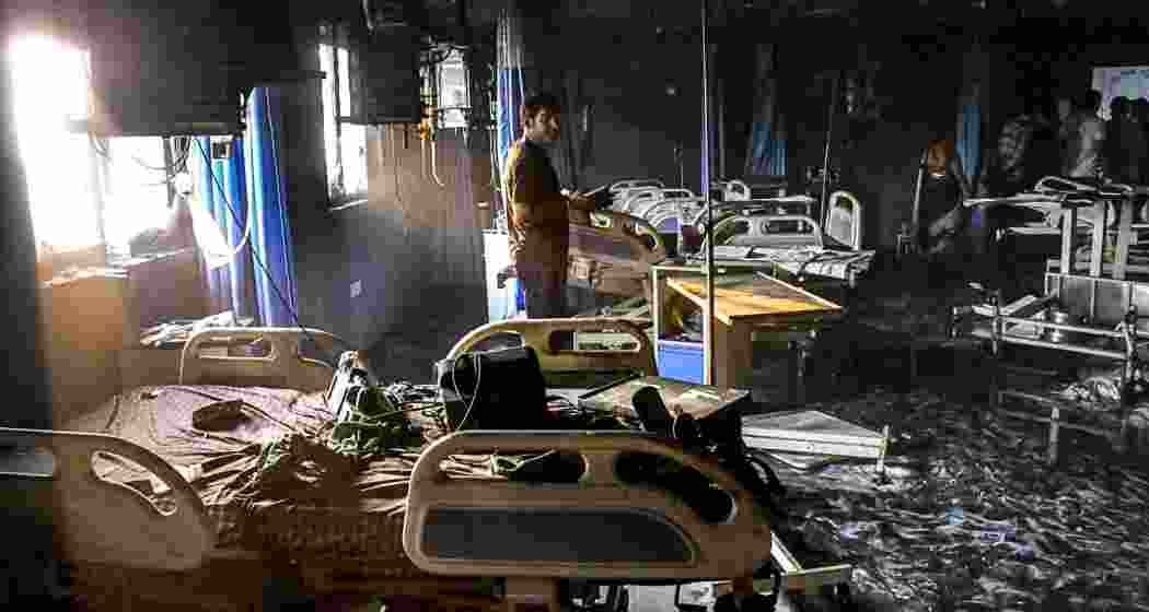 A man looks at the charred remains after a fire broke out in the ICU of a private hospital in Bihar's Muzaffarpur district, Thursday, June 4, 2026. At least three people were killed in the incident. (PTI Photo) A man looks at the charred remains after a fire broke out in the ICU of a private hospital in Bihar's Muzaffarpur district, Thursday, June 4, 2026. At least three people were killed in the incident. (PTI Photo)