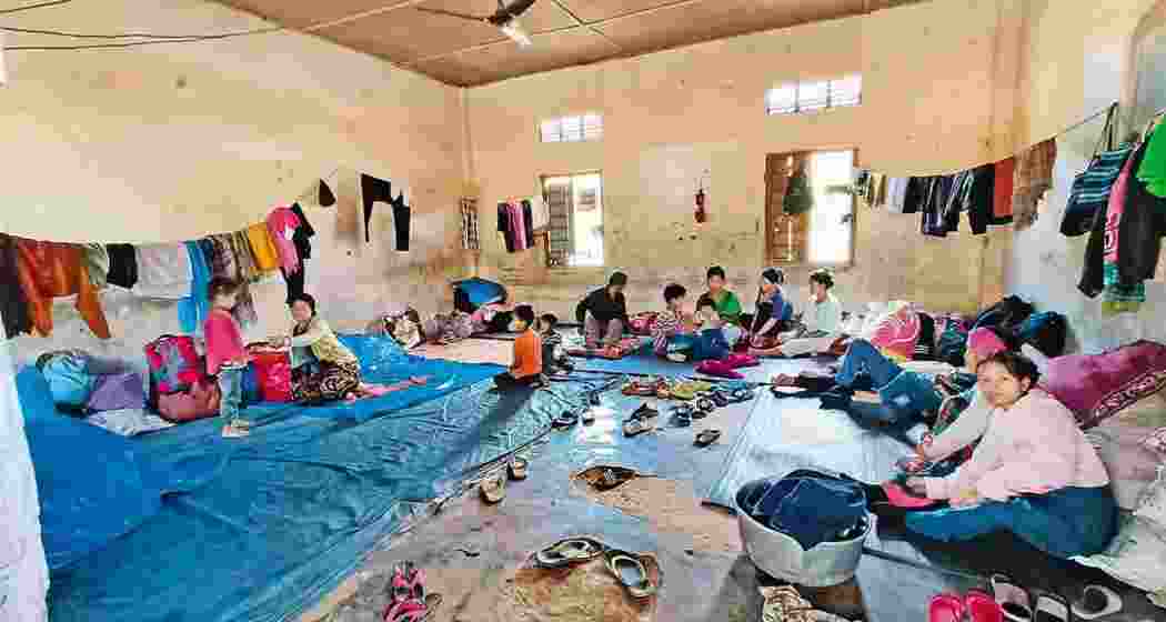 Internally displaced persons (IDPs) take shelter at a relief camp in violence-hit Manipur. PTI photo. Internally displaced persons (IDPs) take shelter at a relief camp in violence-hit Manipur. PTI photo.