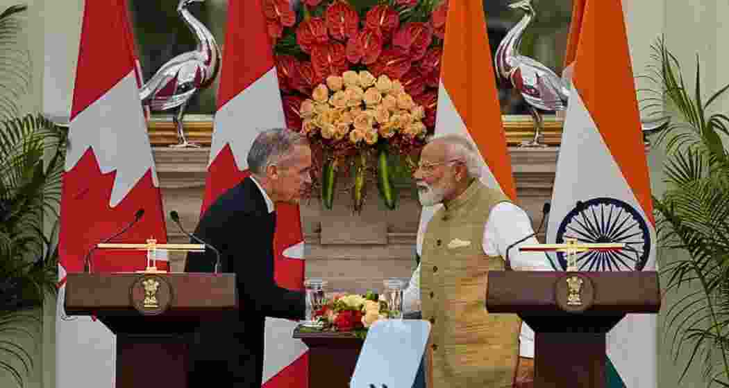 India Prime Minister Narendra Modi, right, shakes hand with his Canadian counterpart Mark Carney after signing of various memorandum of understanding between the two nations in New Delhi, India on Monday. India Prime Minister Narendra Modi, right, shakes hand with his Canadian counterpart Mark Carney after signing of various memorandum of understanding between the two nations in New Delhi, India on Monday.