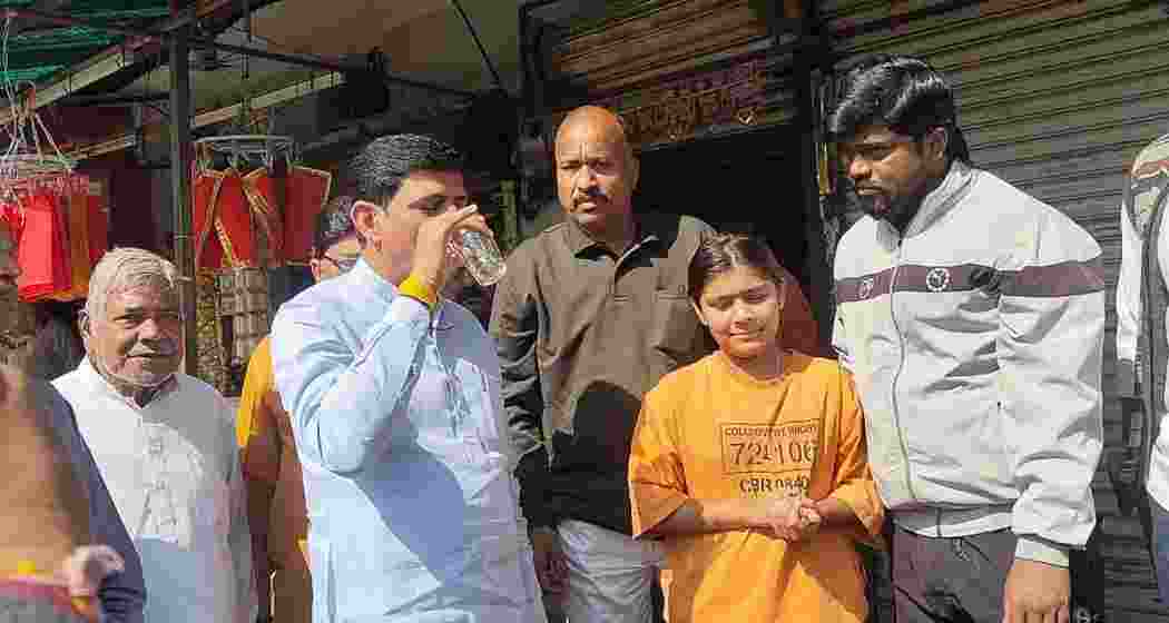 Indore Mayor Pushyamitra Bhargav drinks tap water during a visit to Sudama Nagar on Monday to counter Congress allegations of contamination. Indore Mayor Pushyamitra Bhargav drinks tap water during a visit to Sudama Nagar on Monday to counter Congress allegations of contamination.