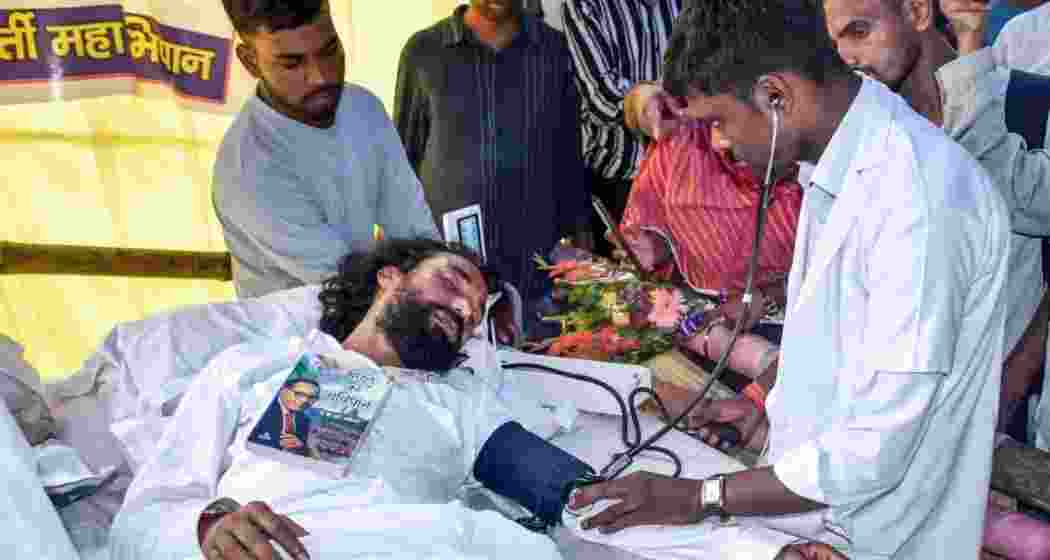 Student leader Devendra Nath Mahto being checked by doctors during his hunger strike in Ranchi. Student leader Devendra Nath Mahto being checked by doctors during his hunger strike in Ranchi.