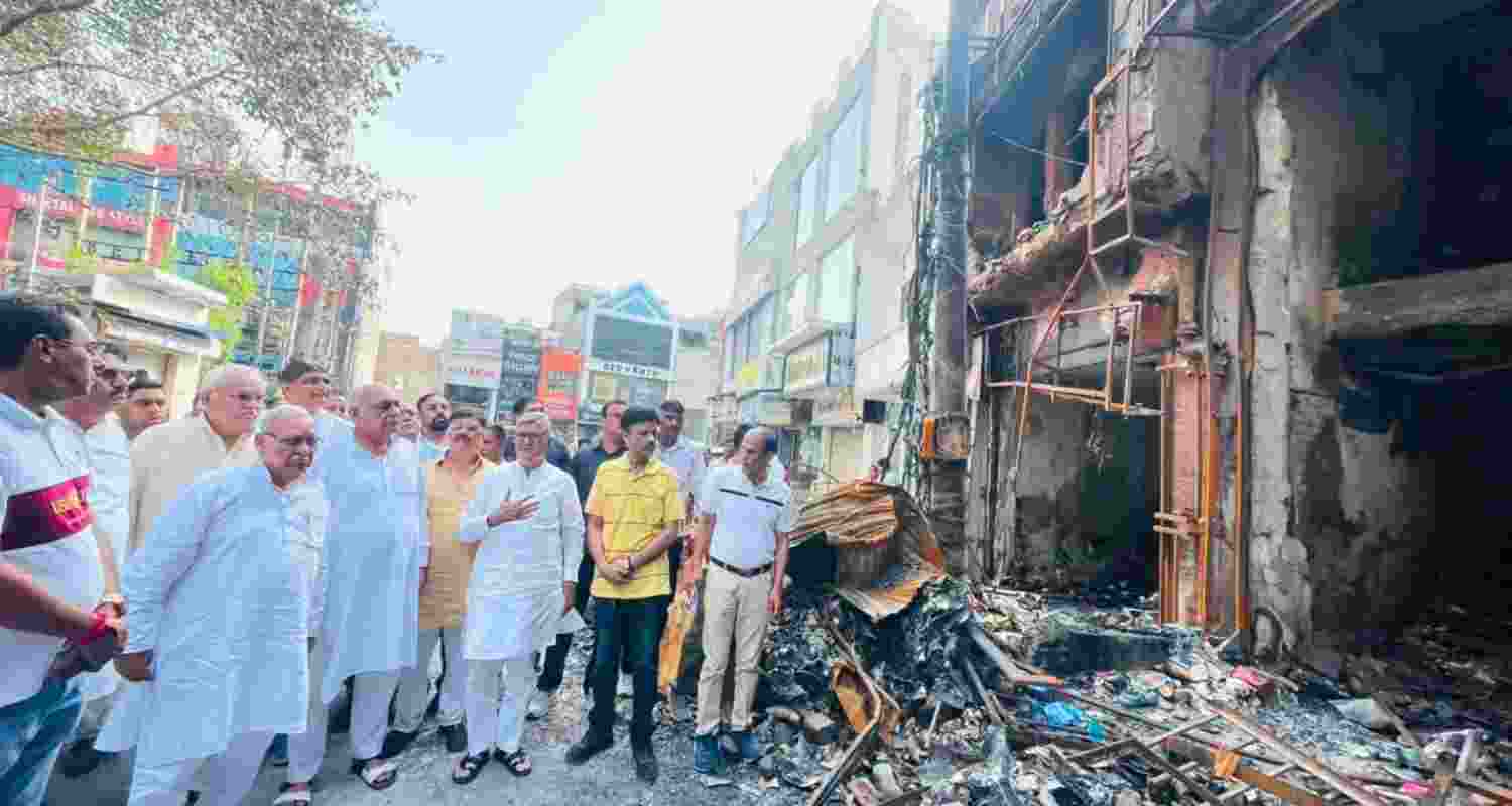 Leader of Opposition Bhupinder Singh Hooda meets families and shopkeepers affected by the recent fire incident in Rohtak's D-Park area on Friday. Leader of Opposition Bhupinder Singh Hooda meets families and shopkeepers affected by the recent fire incident in Rohtak's D-Park area on Friday.