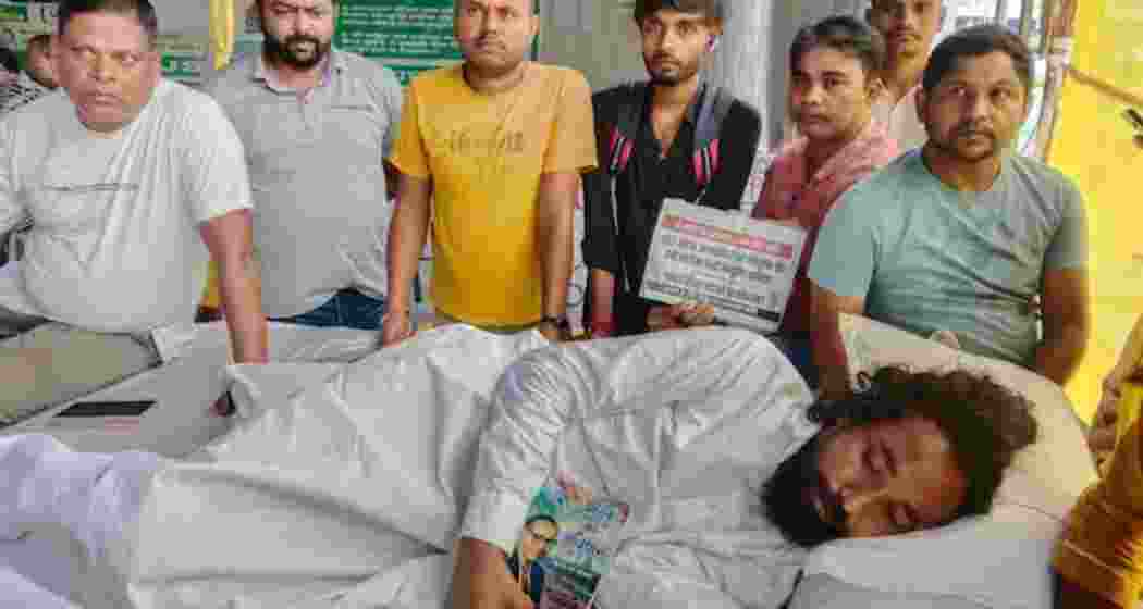 Student leader Devendra Nath Mahto on an indefinite hunger strike as supporters gather around him during the ongoing protest over alleged JPSC and JSSC exam irregularities in Ranchi. Student leader Devendra Nath Mahto on an indefinite hunger strike as supporters gather around him during the ongoing protest over alleged JPSC and JSSC exam irregularities in Ranchi.