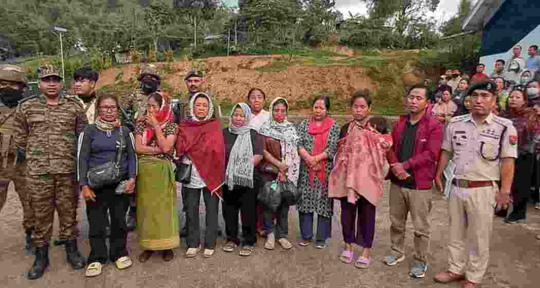Released members of the Kuki and Naga communities under security escort in Manipur after being allegedly held hostage by armed groups in Kangpokpi and Senapati districts. Released members of the Kuki and Naga communities under security escort in Manipur after being allegedly held hostage by armed groups in Kangpokpi and Senapati districts.