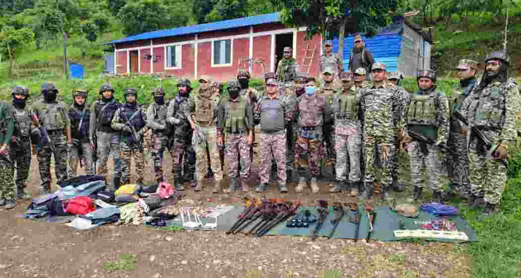 Security personnel display arms, ammunition and protective gear seized during a 36-hour operation across Manipur that saw the dismantling of 61 illegal bunkers and several unauthorised checkpoints. Security personnel display arms, ammunition and protective gear seized during a 36-hour operation across Manipur that saw the dismantling of 61 illegal bunkers and several unauthorised checkpoints.