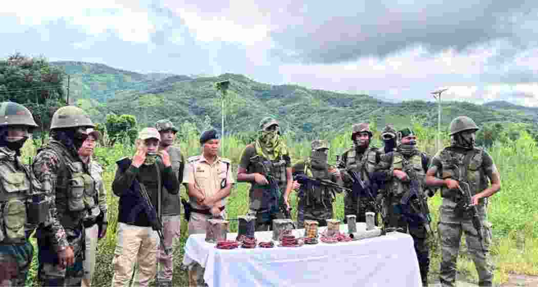 Security forces with a cache of arms and ammunition seized during a raid in Manipur. (File photo) Security forces with a cache of arms and ammunition seized during a raid in Manipur. (File photo)