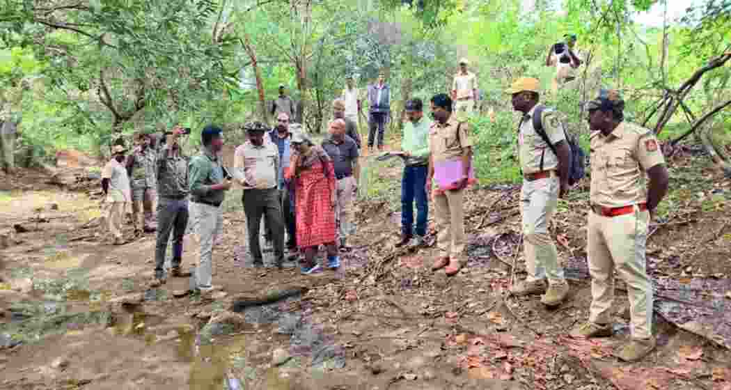 Forest officials at Male Mahadeshwara Hills following the recovery of a tiger carcass. Forest officials at Male Mahadeshwara Hills following the recovery of a tiger carcass.