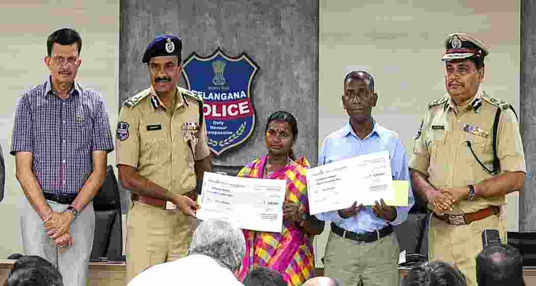 Senior Maoist leader Pasunuri Narahari and his wife Medara Danamma after surrendering before Telangana DGP C V Anand in Hyderabad on Wednesday. Senior Maoist leader Pasunuri Narahari and his wife Medara Danamma after surrendering before Telangana DGP C V Anand in Hyderabad on Wednesday.