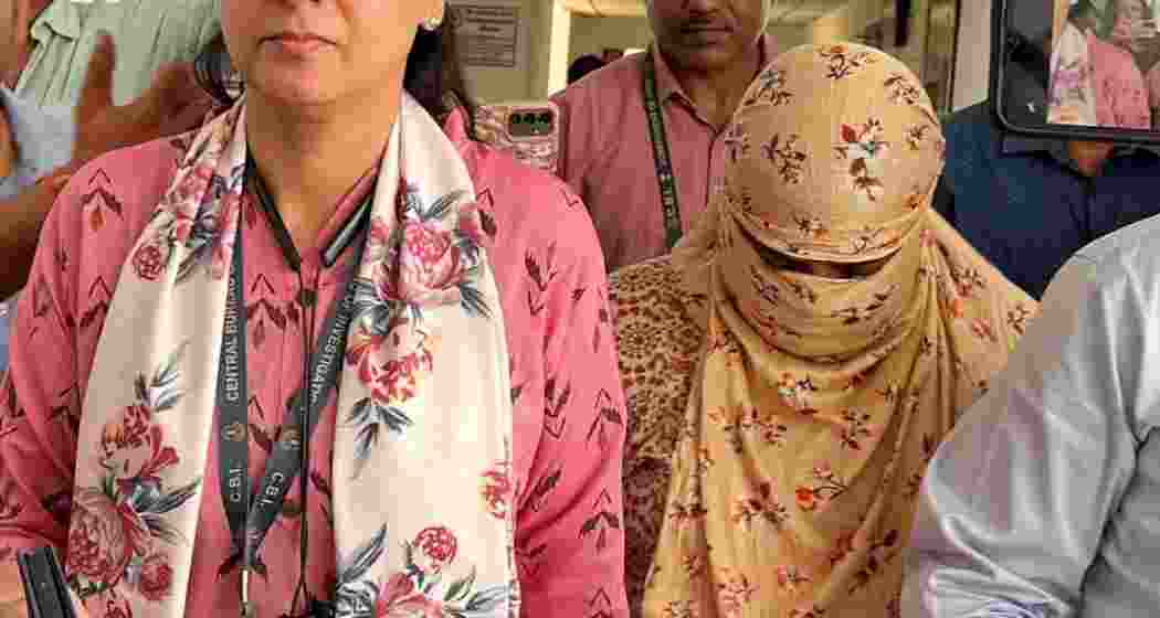 NEET paper leak case accused Manisha Sanjay Waghmare is escorted by security personnel while being taken to a Delhi court for a hearing on her bail plea. NEET paper leak case accused Manisha Sanjay Waghmare is escorted by security personnel while being taken to a Delhi court for a hearing on her bail plea.
