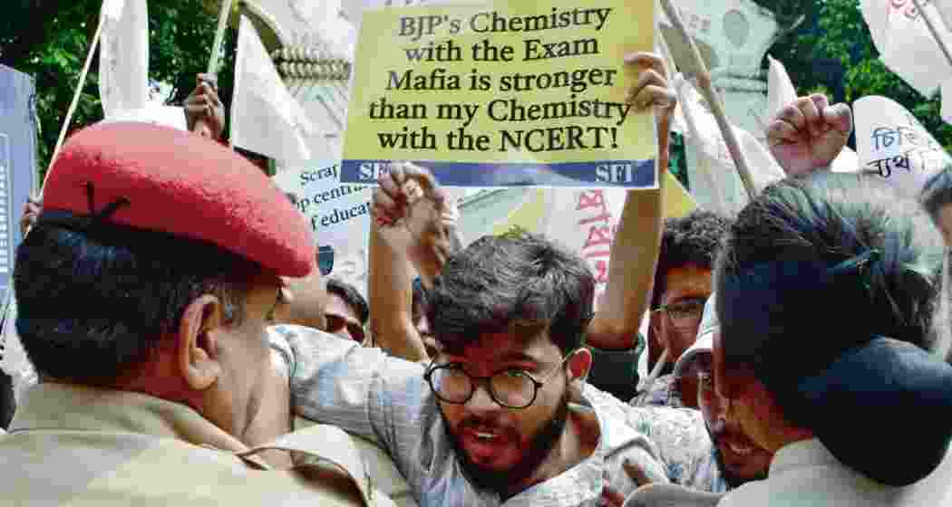 SFI scuffles with police during a protest in front of Cotton University against the leakage of NEET-UG question papers, in Guwahati. SFI scuffles with police during a protest in front of Cotton University against the leakage of NEET-UG question papers, in Guwahati.