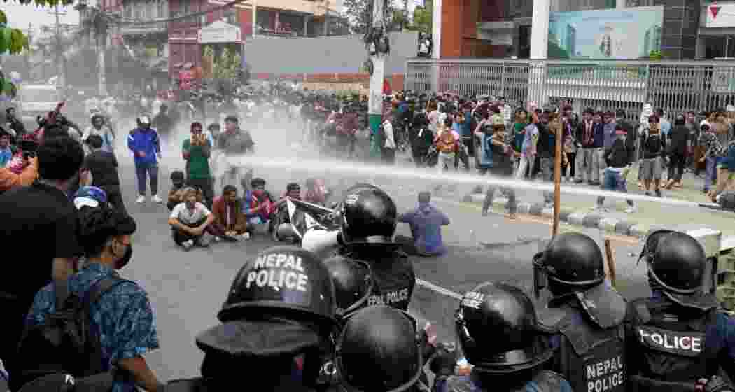 Protesters shout slogans as they gather outside the Parliament building in Kathmandu, Nepal, Monday. Protesters shout slogans as they gather outside the Parliament building in Kathmandu, Nepal, Monday.