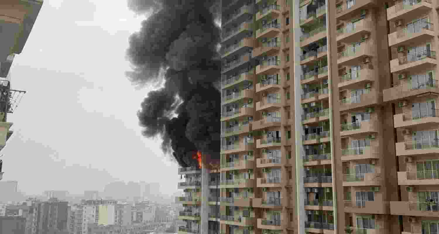 A fire broke out in a 12th-floor flat at Noida's Ivy County society in Sector 75. A fire broke out in a 12th-floor flat at Noida's Ivy County society in Sector 75.