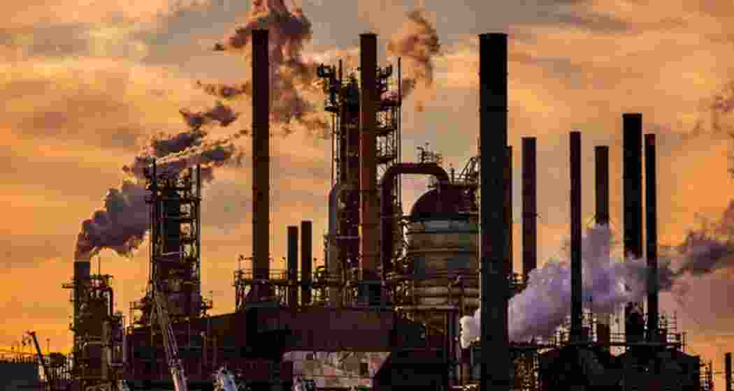 An oil manufacturing facility releasing dense plumes of smoke into the air. (Representative image). An oil manufacturing facility releasing dense plumes of smoke into the air. (Representative image).