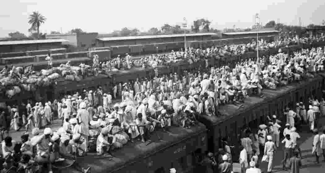 Indians crowding onto trains during the partition of India into a predominantly Hindu state (India) and a predominantly Muslim state (Pakistan) in one of the largest population transfers in history, 1947. Indians crowding onto trains during the partition of India into a predominantly Hindu state (India) and a predominantly Muslim state (Pakistan) in one of the largest population transfers in history, 1947.