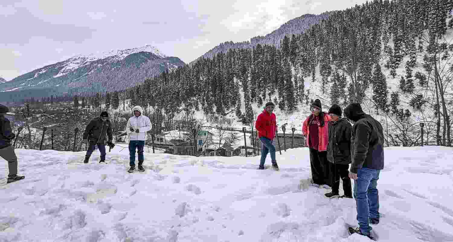 People enjoy after fresh snowfall, in Anantnag district, Jammu and Kashmir, Friday. People enjoy after fresh snowfall, in Anantnag district, Jammu and Kashmir, Friday.