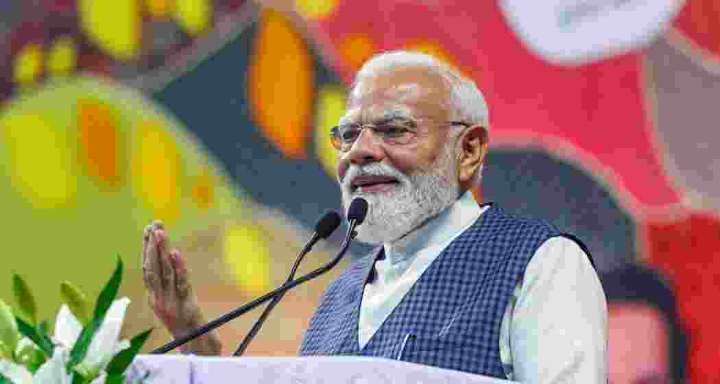 Prime Minister Narendra Modi addresses the inauguration and laying of foundation stones of various development projects, in Surat district, Gujarat on Friday. Prime Minister Narendra Modi addresses the inauguration and laying of foundation stones of various development projects, in Surat district, Gujarat on Friday.